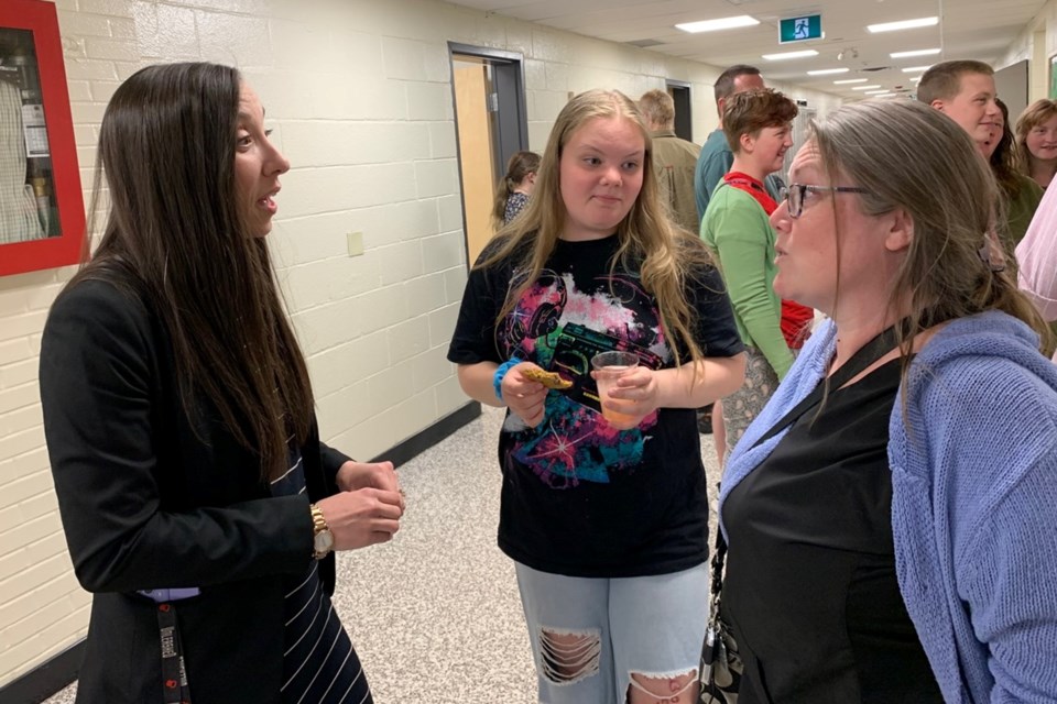 Intermediate principal Amanda Dunbar talks with Alysa Arseneau and her mother Levina at the open house at the high school last week.