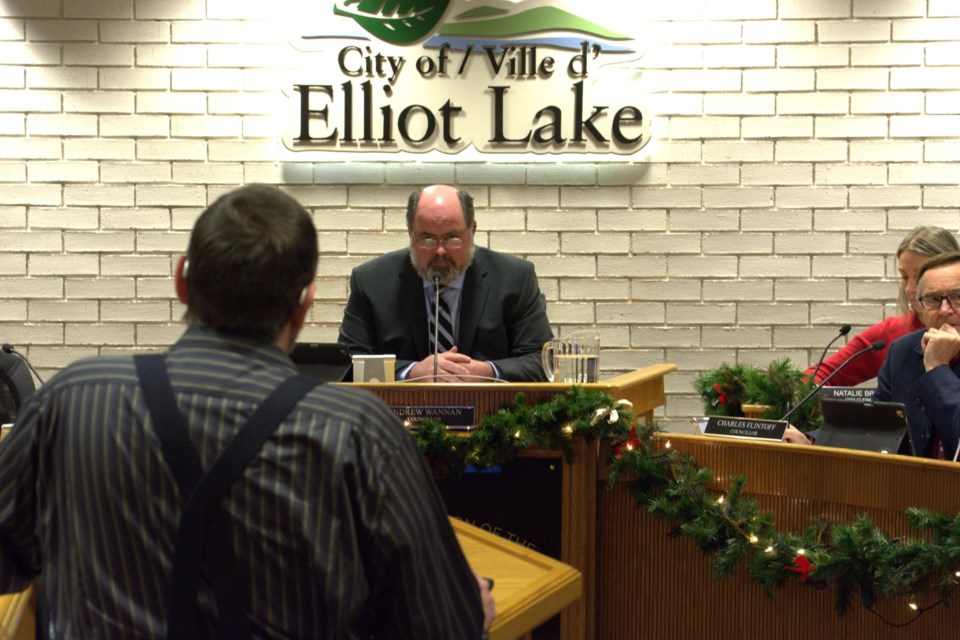 Acting Mayor Wannan and Councillor Flintoff consider Thomas's public input statement. Dec. 20, 2023