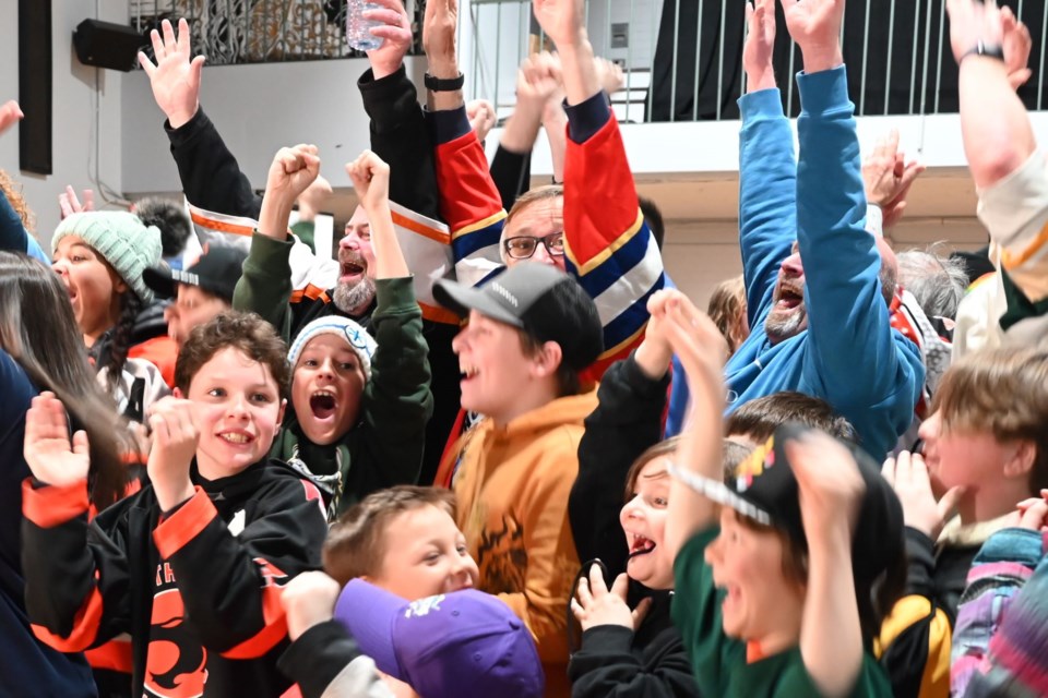 At the moment of announcement. Mayor Andrew Wannan, Couns. Charles Flintoff, and Couns. Merrill Seidel and young Elliot Lakers celebrate the news of the $250,000 win. Mar. 30, 2024