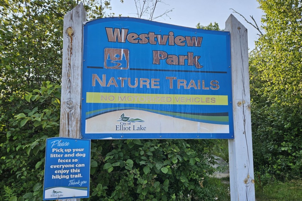 Beach trail sign at Spine Beach. July 22, 2024