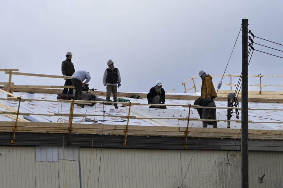 Crews installing roof system during one-day hydro shutdown. December 17, 2024