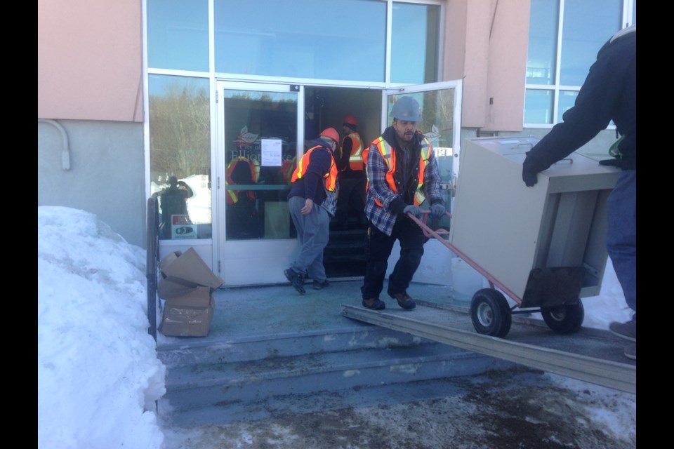 Members of the pottery group and movers for Community Living Algoma remove files and equipment from the centre. Kris Svela for ElliotLakeToday