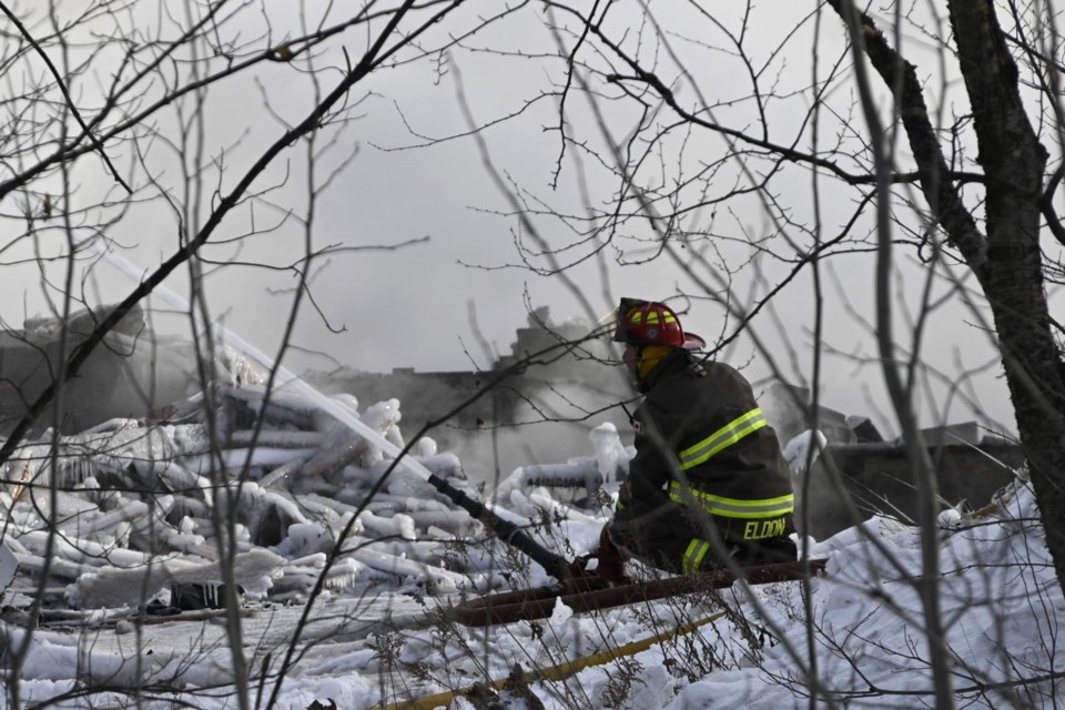 Elliot Lake Firefighters continue to work at the site of the fire that destroyed 22 Hirshhorn Avenue well into the morning after the fire started.