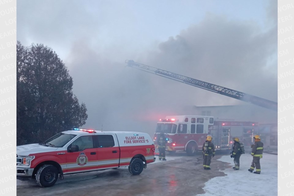 Smoke fills the air as Elliot Lake Fire Services try to battle the blaze on Hirshhorn Avenue to no avail. 