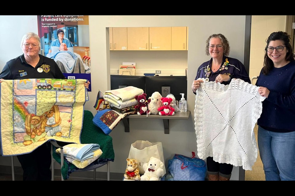 Crystal Steffler and volunteers donate some quilts to the Guelph General Hospital and Grand River Hospital Foundations.