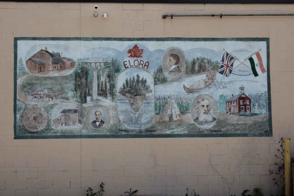 This mural depicting Elora's history and places was painted in 1982 on what was Little Katy's Shoppette. This photo is of the original mural, not the new photos.