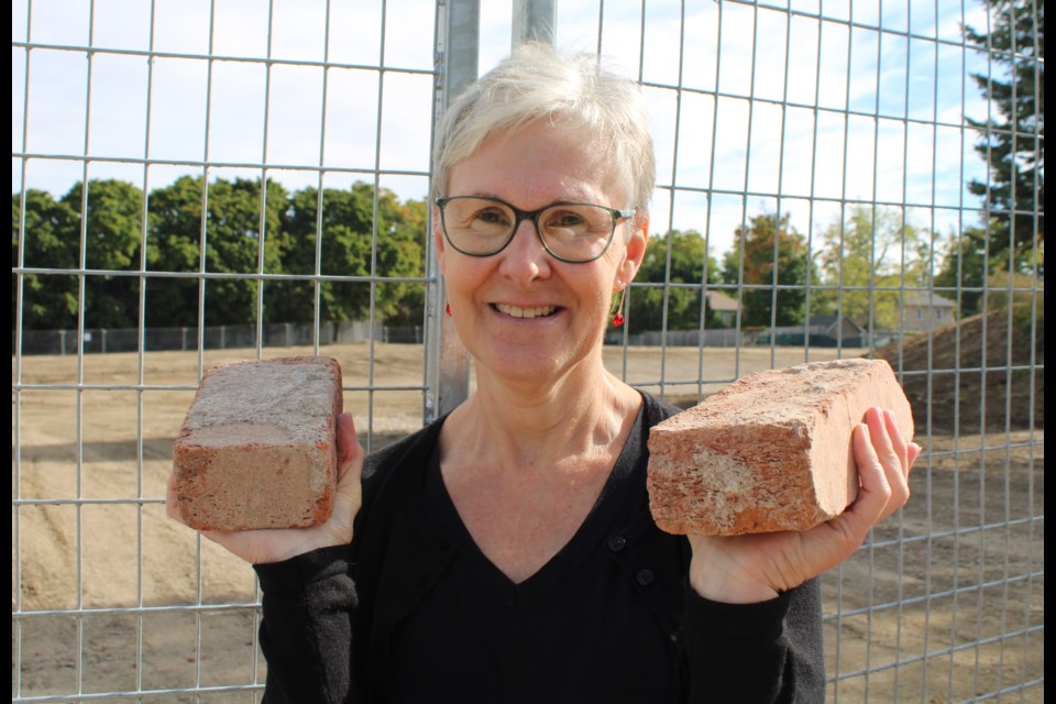 Linda Benallick got two bricks, one for her brother, as both were born there. 