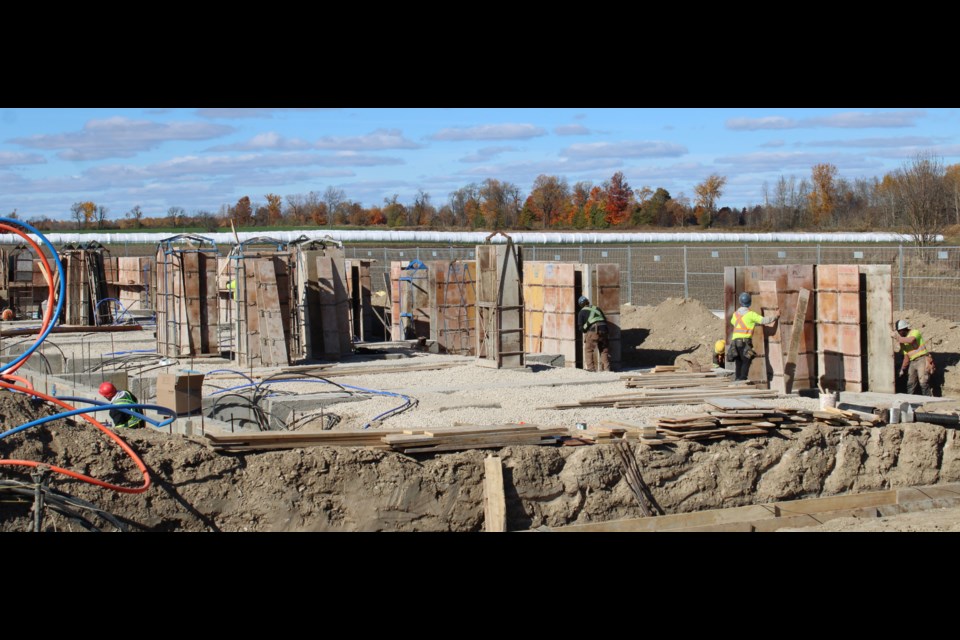 Workers were getting the foundations ready for the stacked townhouse development.