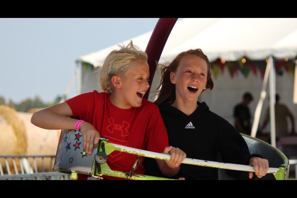 A couple of boys enjoying the ride at the Fergus Fall Fair Saturday. 