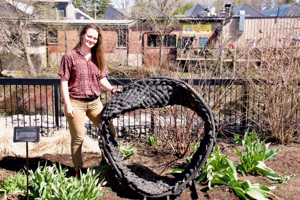 Megan Sanderson with sculpture 15 called 'Mobius Twist.'