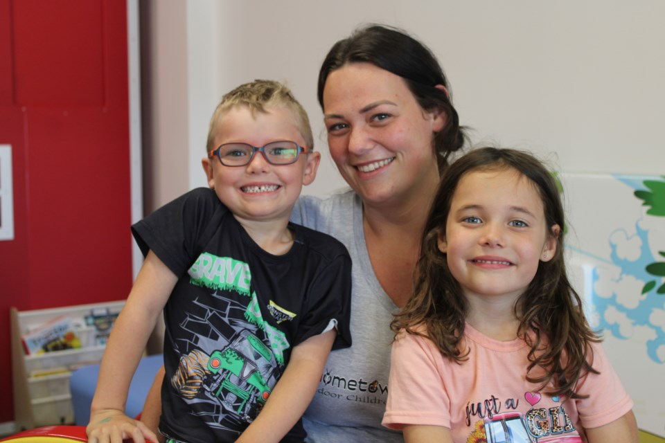 Bethany Bolger with her twins Breyer, left, and Harper at her new indoor playroom business. Bolger's children gave their input into what would be fun for children in the space.