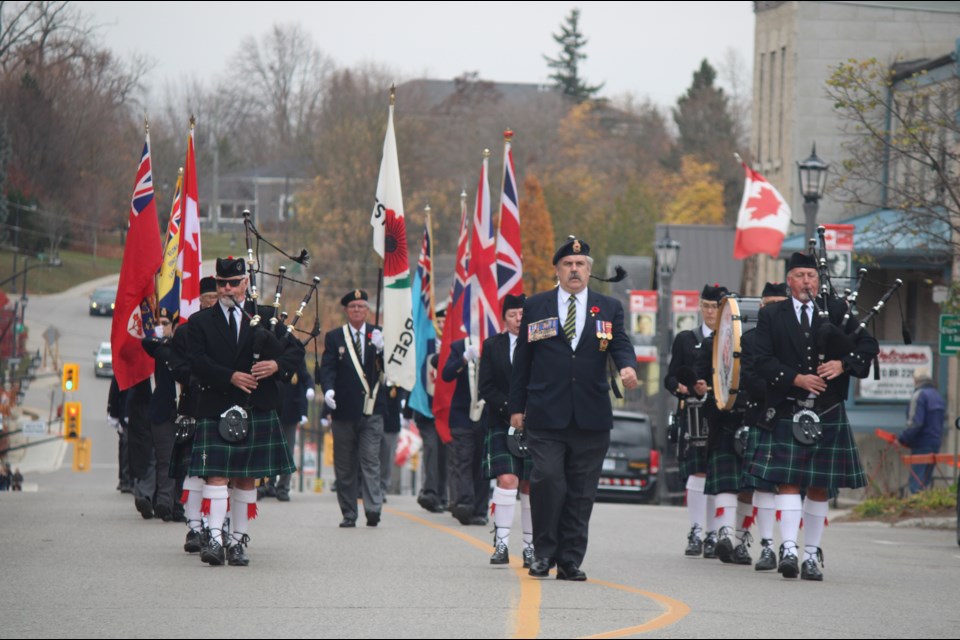 Greg Oakes, veteran services officer for the Elora Legion, led the parade up Metcalfe Street in Elora to the cenotaph. 