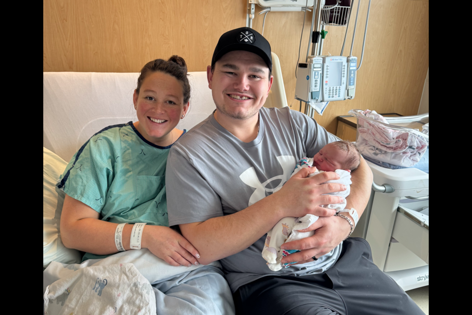 Brittany and Jake Roberts with Maeve, the first baby born at Groves Memorial Community Hospital in 2025.