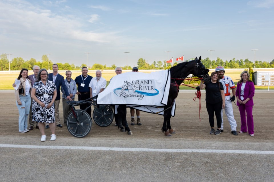 the winner of Race 4 Prince Archie, Driven by Steve Hudon, Trained by Laura Toscani, Owned by Gino Toscani. From left to right;
Kate Edmundson, Jennifer Bodner, Director of Business Operations Ontario Racing, Robert Davies, Director GRAS, Gordon Thain, Executive Director Ontario Racing, Isaac Scott VP Finance GRAS, Sean Duvall, Director of Horse Racing OLG, Tony Morris, Director GRAS, Garth Green, President GRAS, Doug McCaig, Facilities Manager GRR, Steve Hudon, driver, Jenna MacDonell, GRR.
