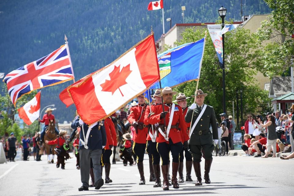 The colour guard leads the Canada Day parade down Patricia Street on Monday, July 1, 2024.