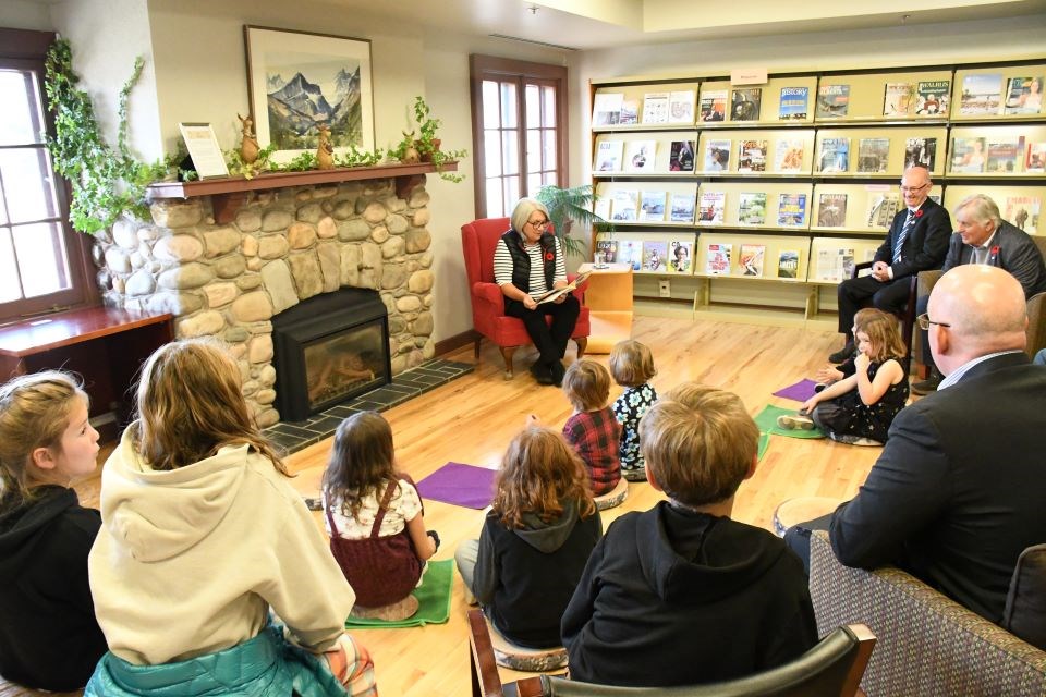 Governor General Mary Simon reads "Fishing with Grandma" to children at the Jasper Municipal Library in Jasper, Alta. on Saturday, Oct. 26, 2024.