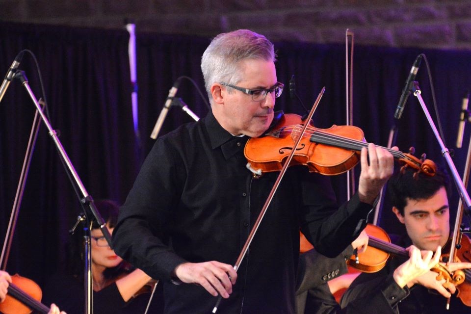 Violinist Eric Buchmann with the Edmonton Symphony Orchestra plays during a concert at Fairmont Jasper Park Lodge on Sunday, Oct. 20, 2024.