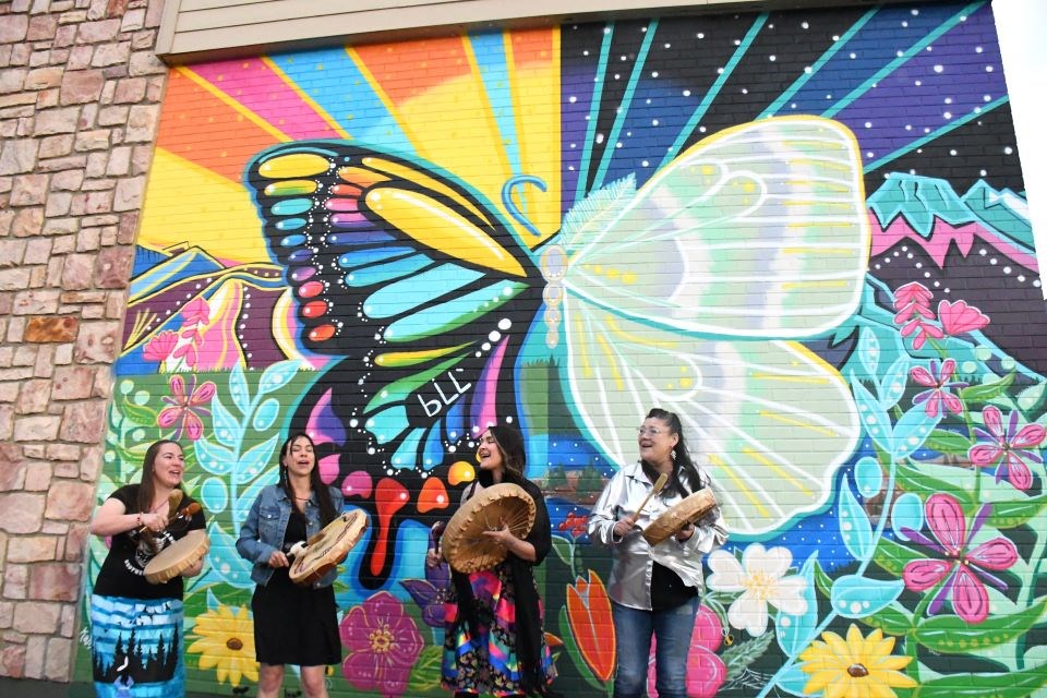 Mackenzie Brown (a.k.a. Kamamak) unveiled her butterfly mural on Wednesday, May 22, 2024 as part of the UpLift! Jasper Mural Festival. The mural is located on the Telus Wall (203 Miette Avenue) facing Miette Avenue and the new Fire Hall. | Peter Shokeir / Jasper Fitzhugh