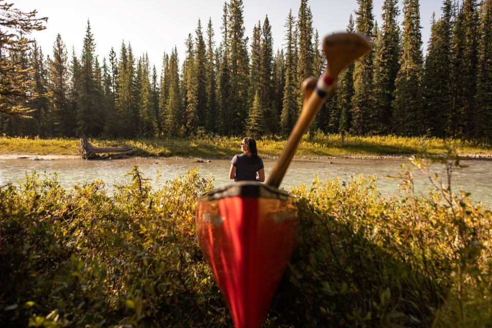 Meghan J. Ward in a canoe as the team prepares to launch in Maligne River.