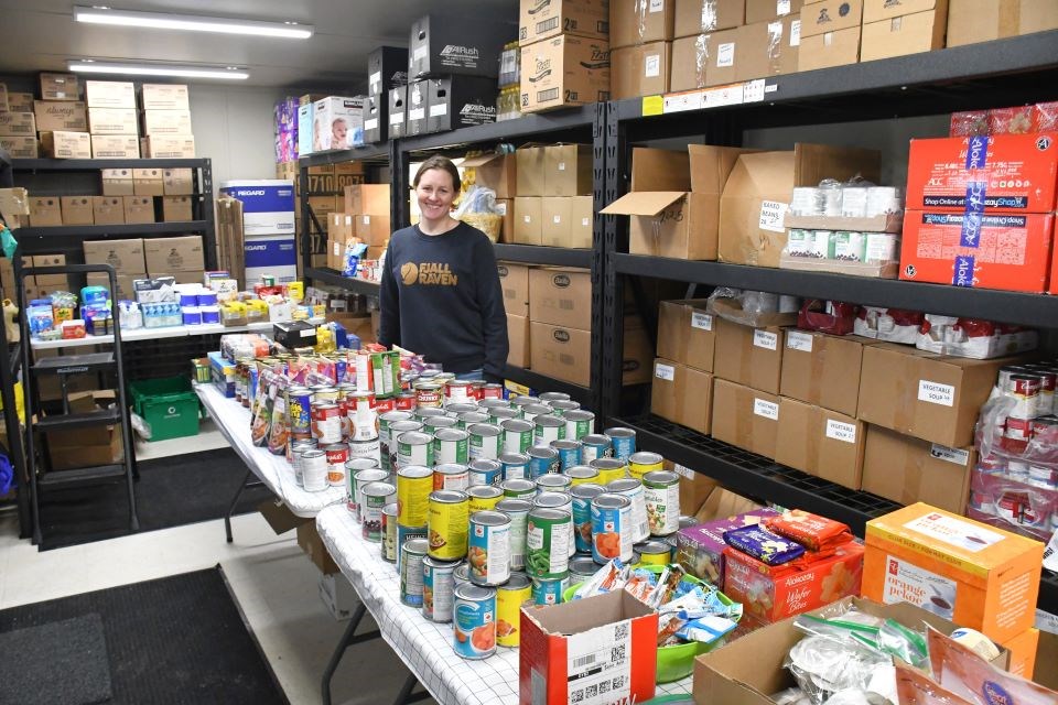 Blaine Wylde, operations manager of the Jasper Food Bank, stands inside the food bank's new trailer at the Jasper Activity Centre parking lot on Thursday, March 6, 2025.