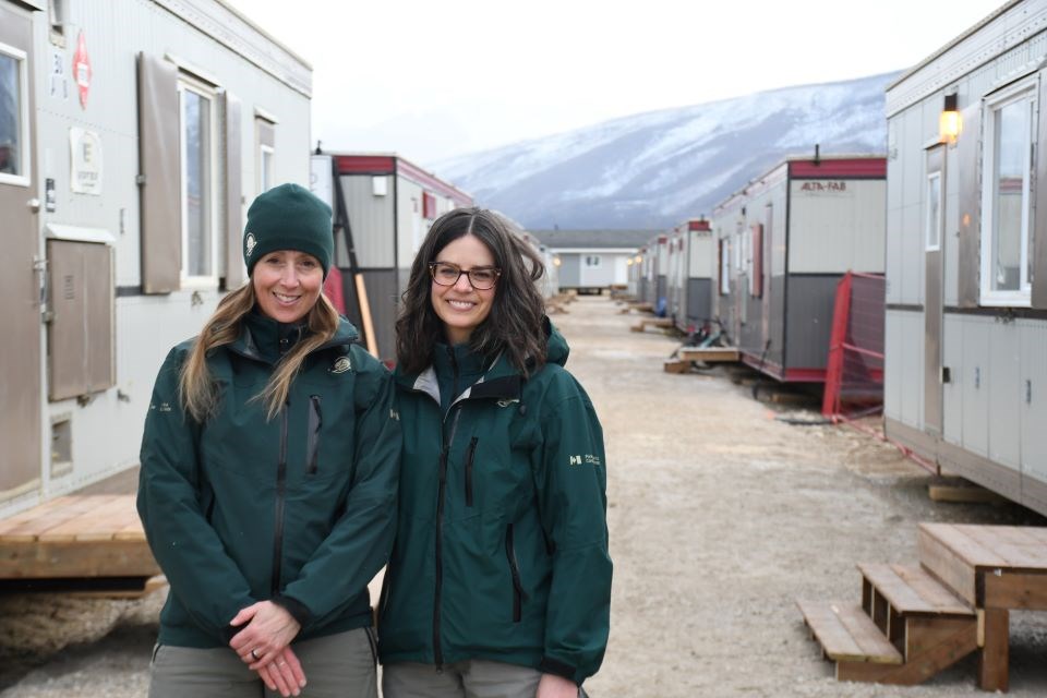 Caroline Roy (left) and Amy Cairns with Parks Canada at an interim housing site along Connaught Drive in Jasper, Alta. on Wednesday, March 5, 2025.