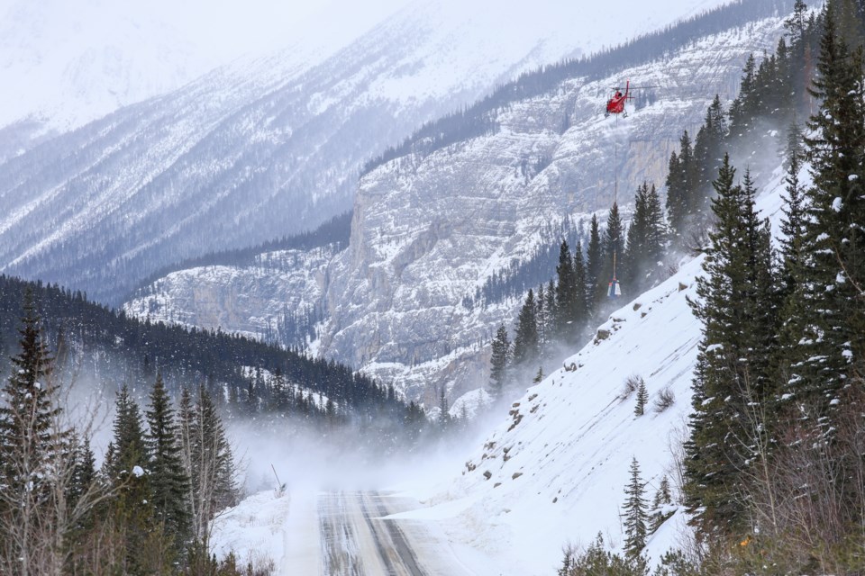 A helicopter with a DaisyBell engages in avalanche control work along the Icefields Parkway on Friday, Jan. 17, 2025.