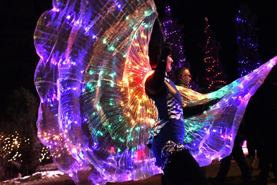 Erica Stables spreads her wings during the Street Party along Patricia Street in Jasper, Alta. on Saturday, Jan. 25, 2025.