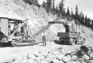 Heavy machinery was brought in to help finish construction of the road after once the Second World War started. Jasper-Yellowhead Museum and Archives.