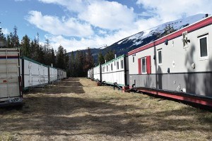 Parks Canada recently set up nine trailers in the old woodlot across from Old Fort Point Road to house its staff this summer. P. Clarke photo.