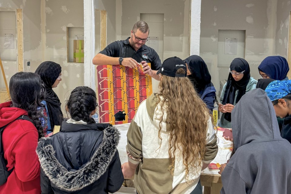 Students watch a demonstration during the WE BUILD showcase at Mohawk College.