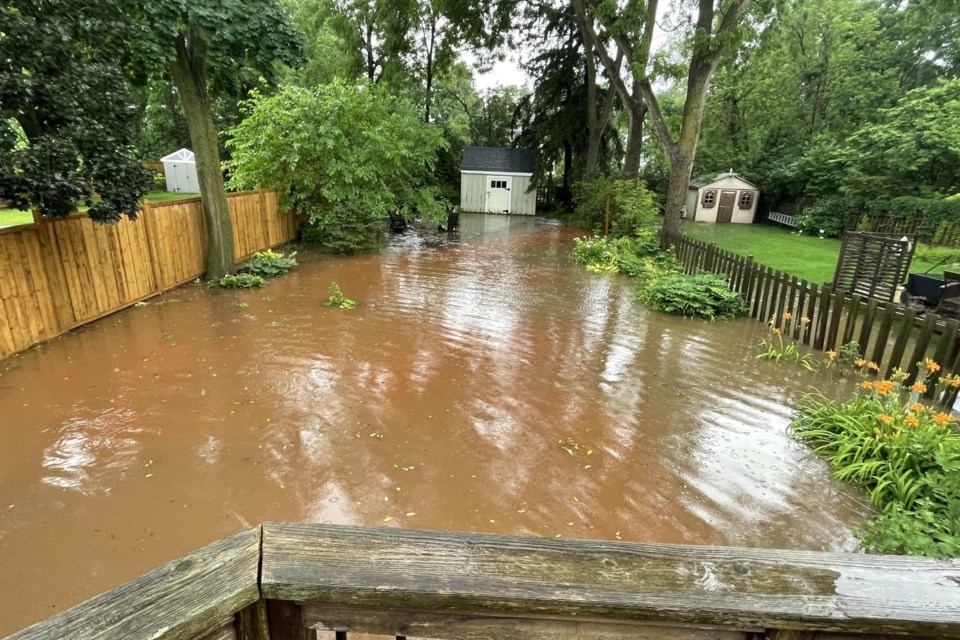 A backyard on Mill Street North completely flooded on Monday night. 