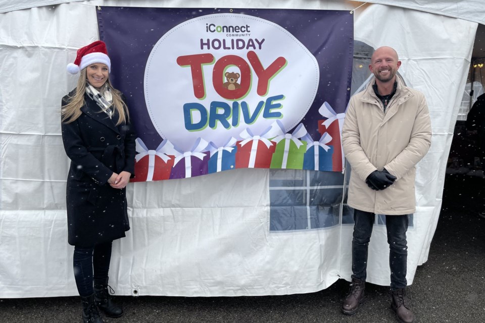 Amy Boren and John A. Krpan at the iConnect Toy Drive. 