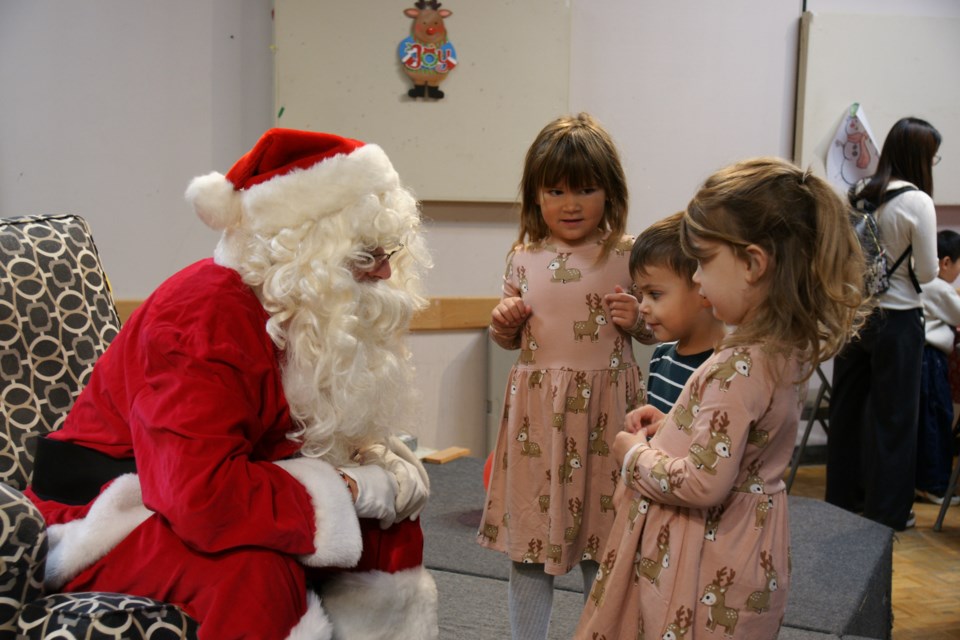 Santa visits with some young fans at the Pancake Breakfast in Waterdown on Saturday.