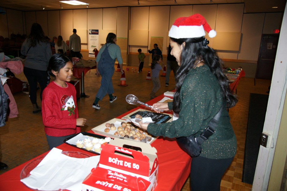 2024-12-07-winterdown-chloe-joy-8-being-served-donuts-by-akshara-deepak-gf