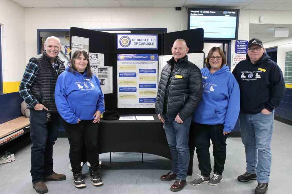 Carlisle Optimist Club members (left to right) Rob Therkildsen, president Leslie Elaschuk, Hugh McCullough, treasurer Sue Beckwith and Learn to Skate coordinator Rob O'Brien were on hand Wednesday at the Carlisle Arena, which marked a special milestone this week.