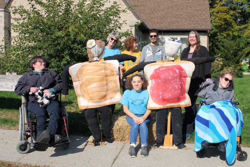 Left to right: Graceful Abilities participant Chris, volunteer Sue Hickey, staff member Gloria Asaph, participant Barhomi, staff member Kayla Stinson and (seated) Tracey Adomeit and participant Julia.