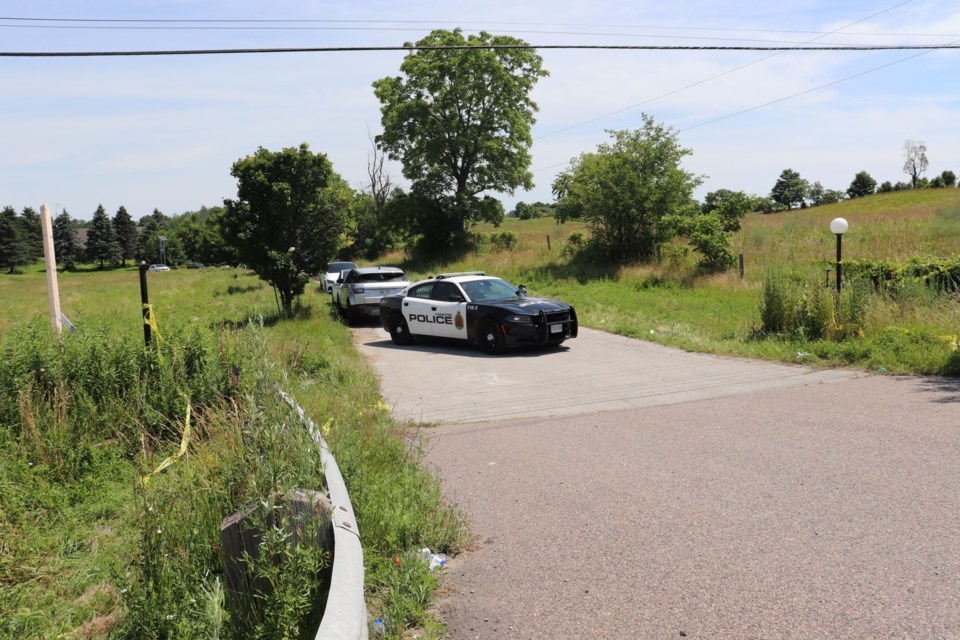 Police remain at 1046 Hwy. 6 in Flamborough on Tuesday, following a deadly shooting early Sunday morning. 