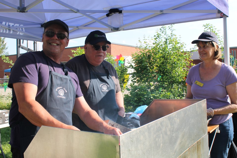 Carlisle Optimists (left to right) Wayne Turnbull, Rob O'Brien and Laurie Millar work the grill at the Balaclava School Fun Fair.