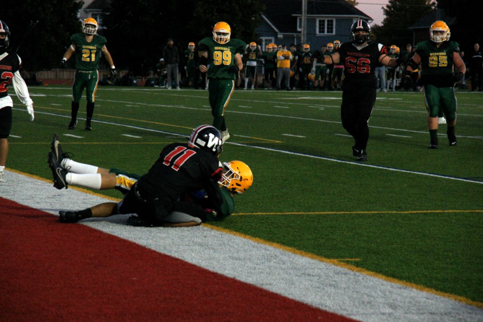 Arya Baha takes down a Westdale player on the goal line during Thursday's game at WDHS.