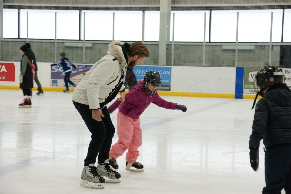 Dave Lysecki and eight-year-old daughter Lucy of Dundas take a spin around the ice at Harry Howell Arena on Saturday.