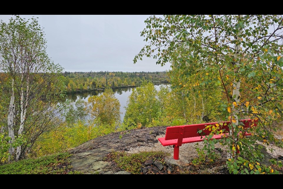 An overlook along the wâhkôhtowin
Trails path at Phantom Lake, featuring a bench and views of the lake. The trail committee has cleared off a path near the lake's former campground for this summer and plans to open more trails in the future.