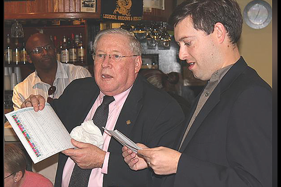 Frank O'Leary, center, dissects results of the 2011 general election with then-Arlington County Democratic Committee chair Mike Lieberman. Terron Sims II looks on.