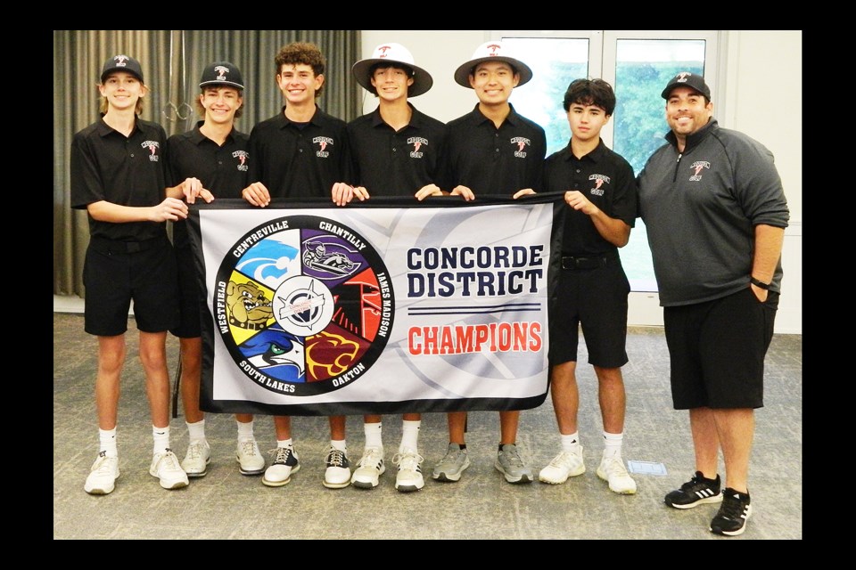 The six Madison High School golfers won participated in and won the Concorde District tournament gather with the championship banner along with head coach Mike Serone.