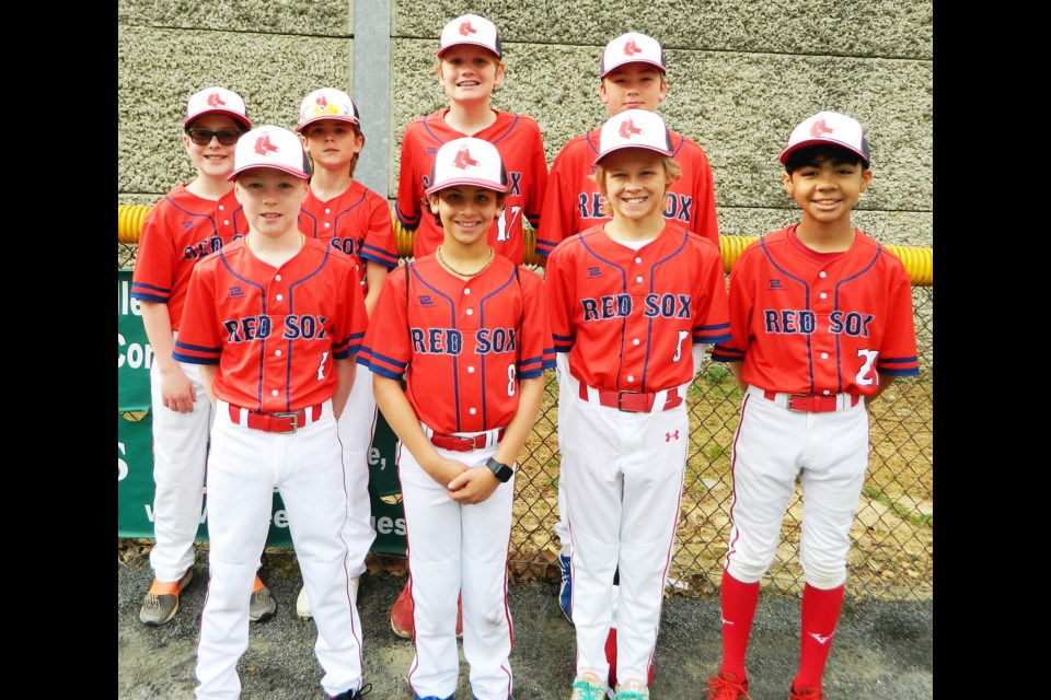 The Majors Red Sox teams was a participant in the opening-day parade.