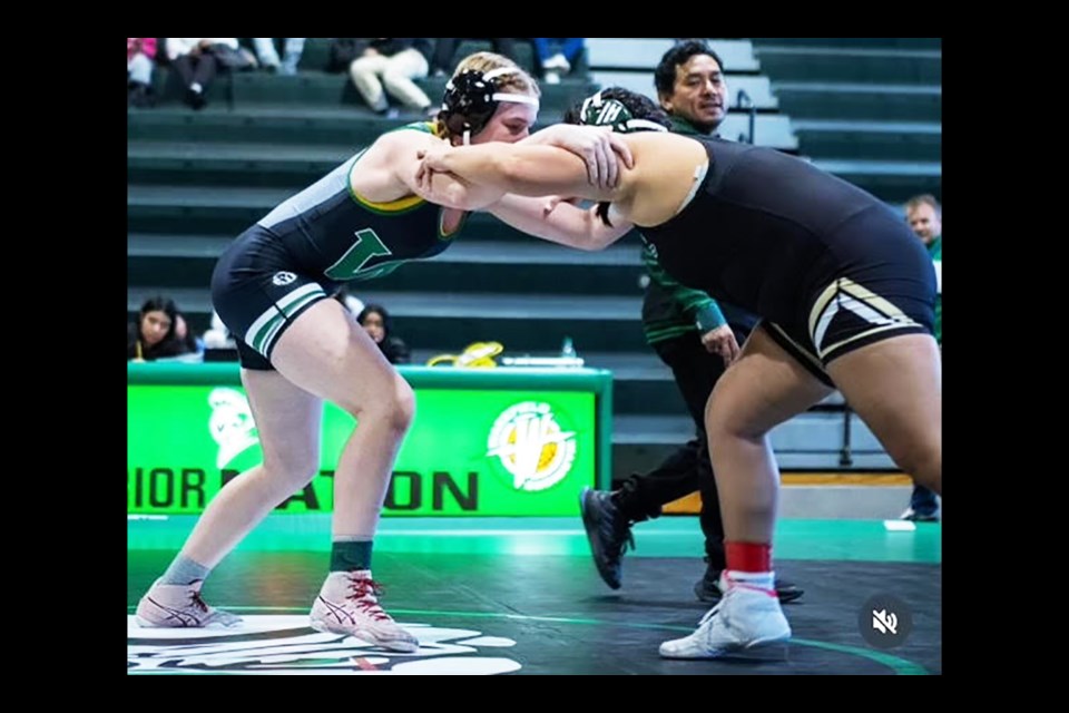 Wakefield's Cameron Millsapps, left, wrestles in a match this season.