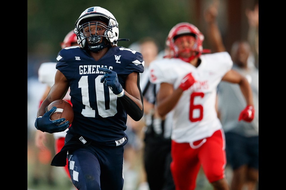 Washington-Liberty's Anthony Louis approaches the end zone on his long touchdown kick return.