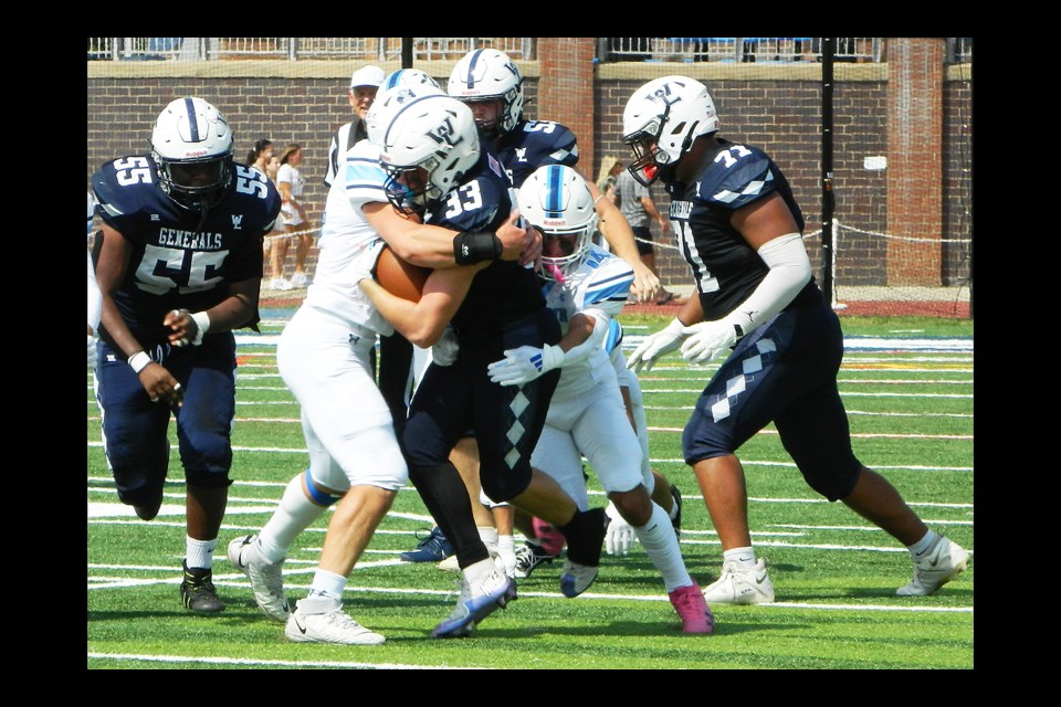 Members of the Washington-Liberty offensive line opened holes for the team's running backs during the Sept. 21 game against the Yorktown Patriots.