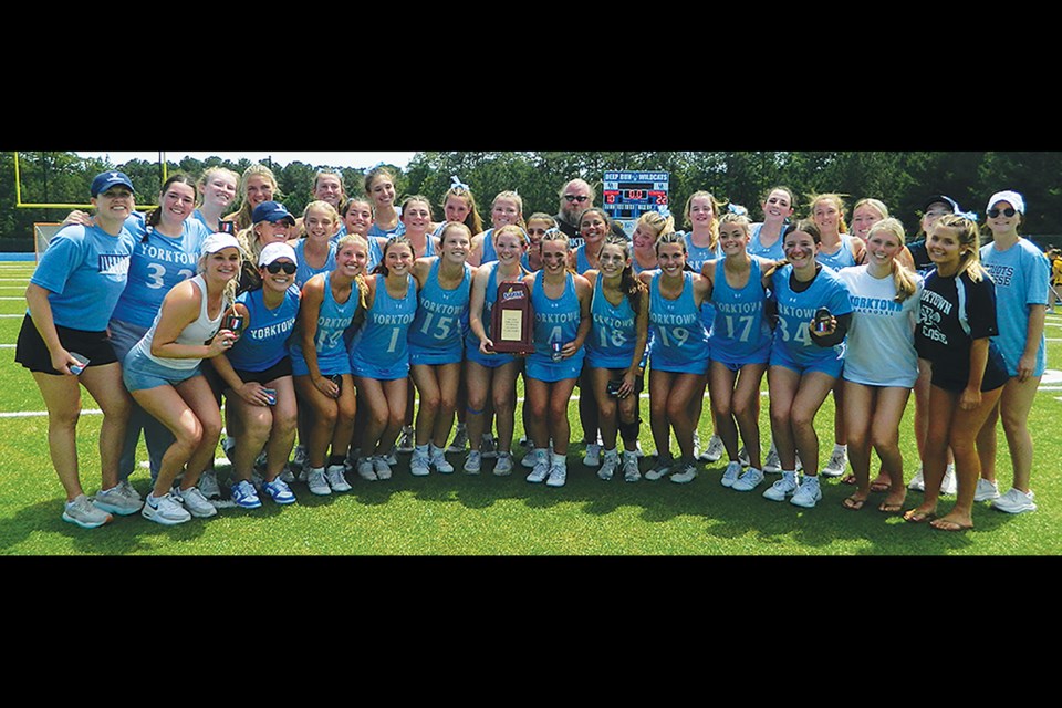 The Yorktown Patriots gather with the Class 6 girls state championship lacrosse trophy. 