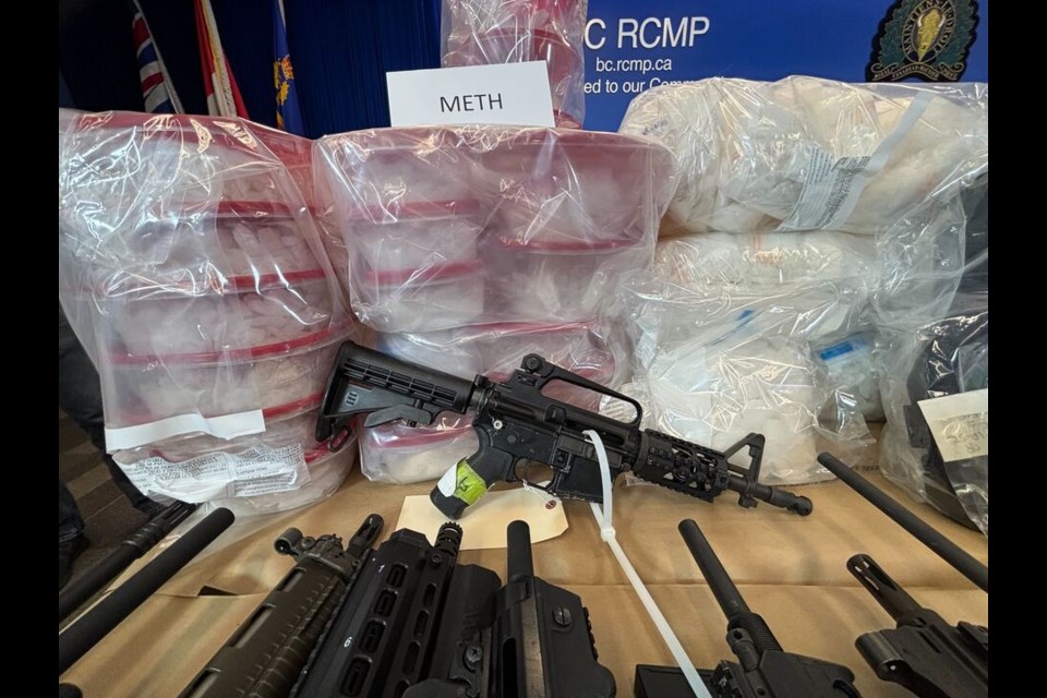 Bags of fentanyl and methamphetamine, alongside rows of firearms were showed off at BC RCMP headquarters in Surrey Thursday.