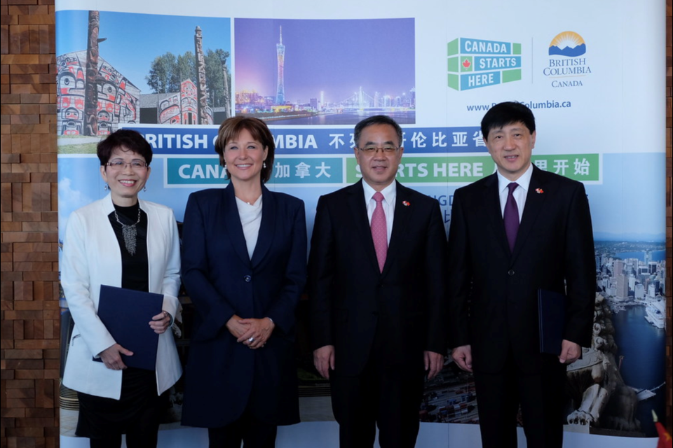 Teresa Wat with Premier Christy Clark and Hu Chunhua, Politburo member, in 2016.